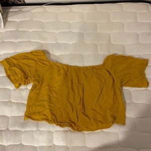 Yellowish orange off the shoulder crop top